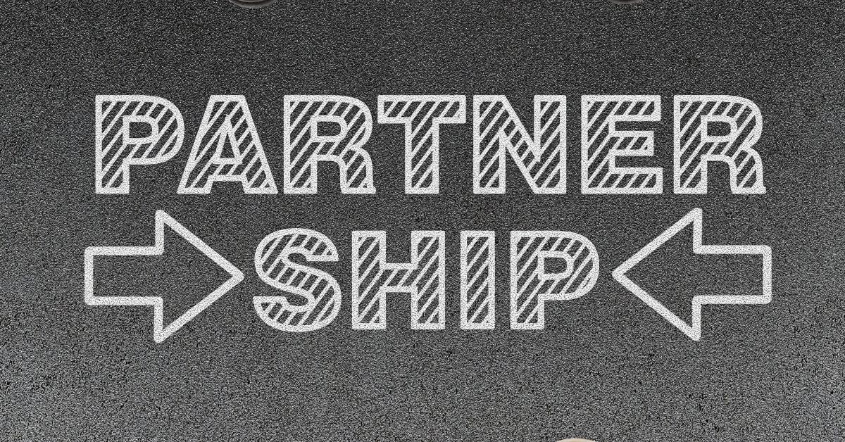 Choosing A Staffing Partner: Chalk writing of the word "Partnership" on what appears to be a paved surface.