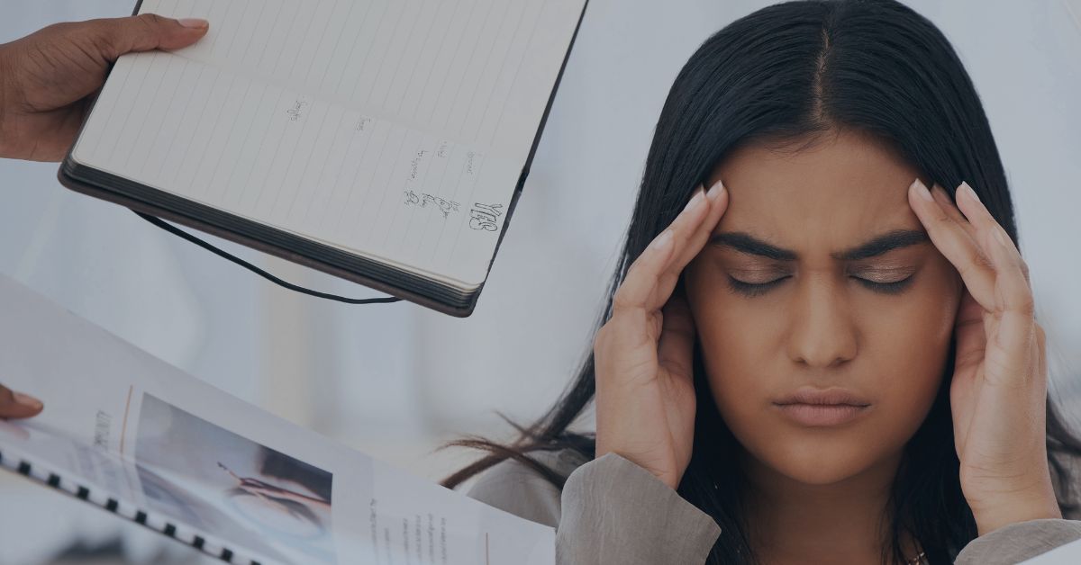 Managing PTO And Leave Programs: A woman being handed multiple objects. She is obviously overwhelmed, and has her hands steepled on her temples to indicate her frustration (or a headache).
