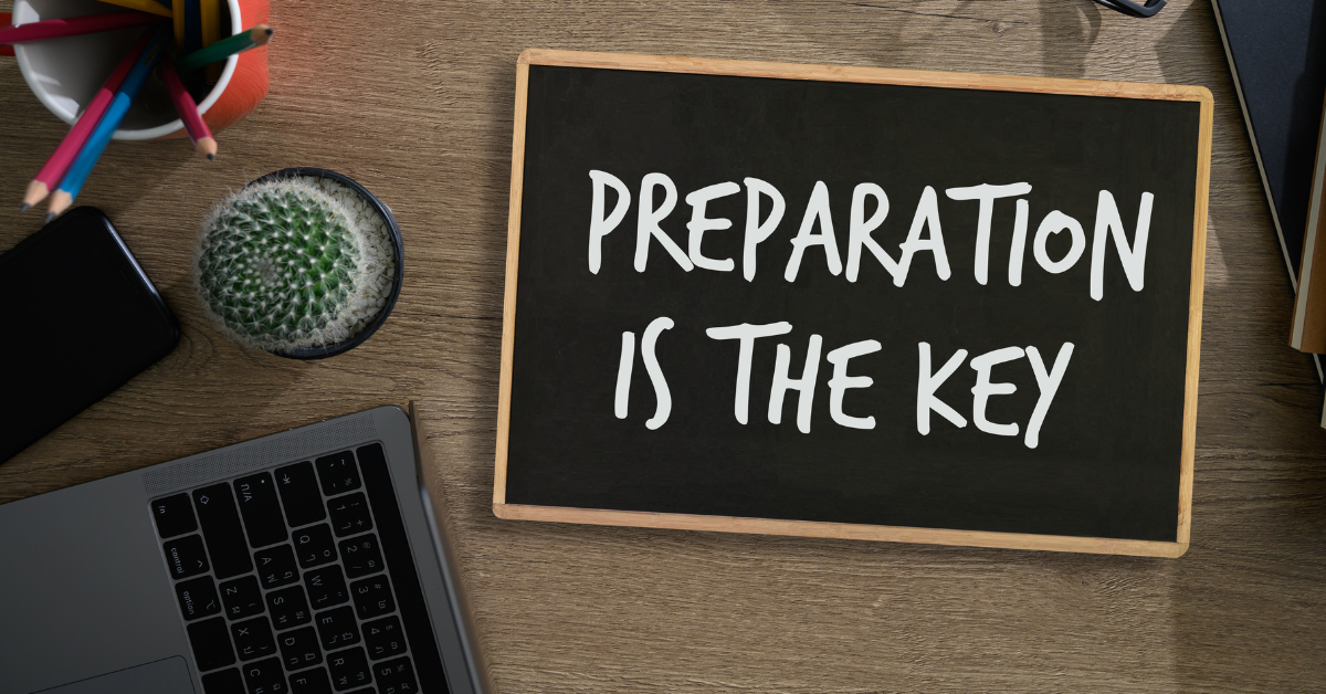 Build Confidence Through Interview Preparation: Chalk board sitting on a table top. The board reads, "Preparation is the Key".