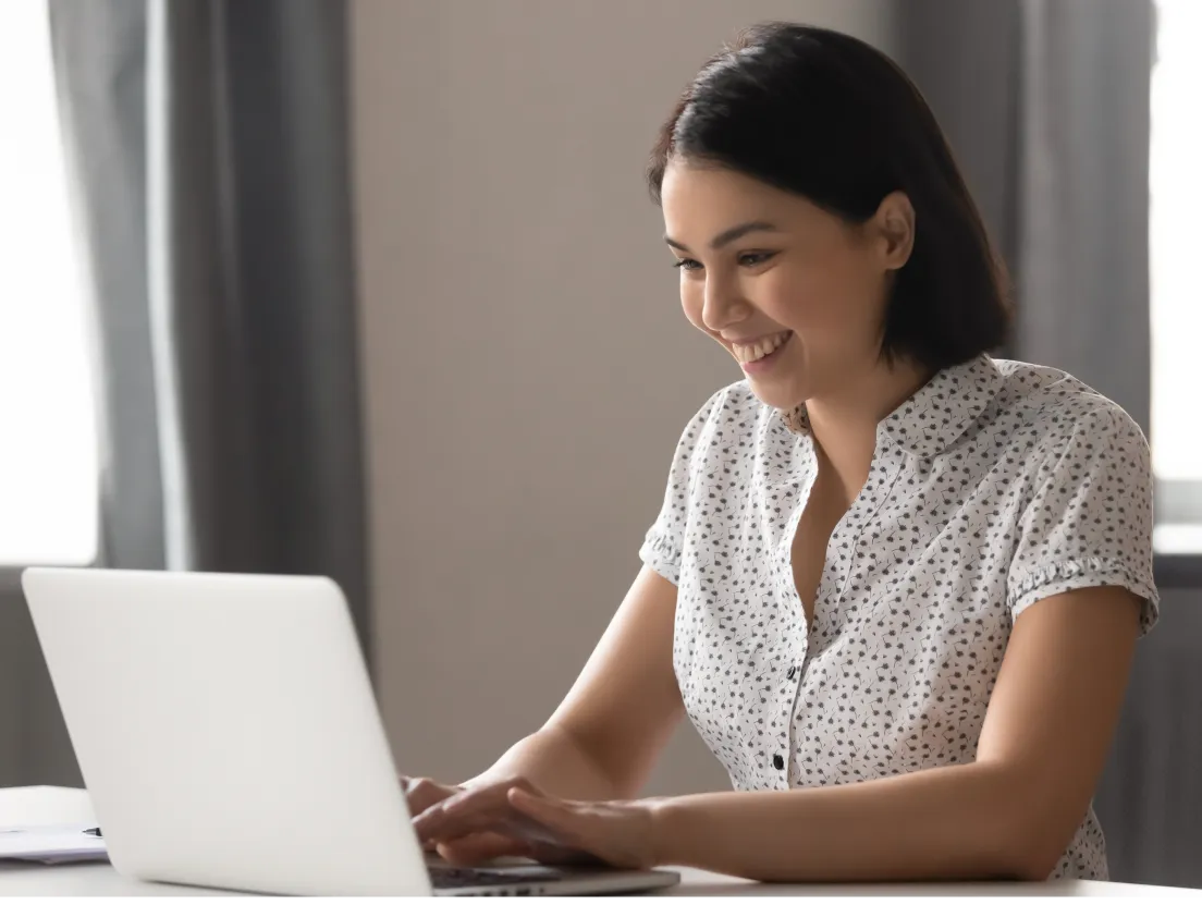 Female Work From Home Smiling Viewing Laptop