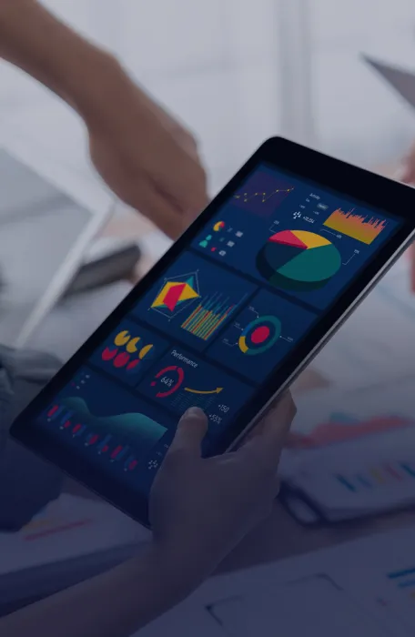 Hand Holding Tablet With Business Data
