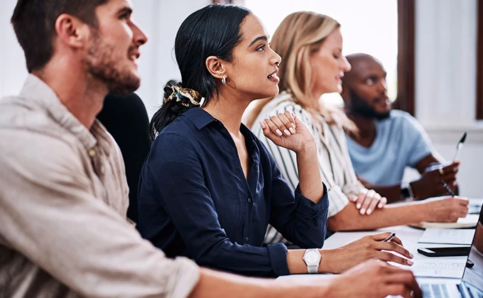 Staff Listening At A Meeting