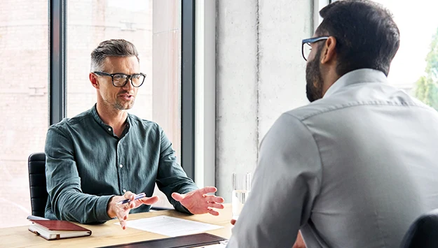Two Diverse Business Partners Negotiating